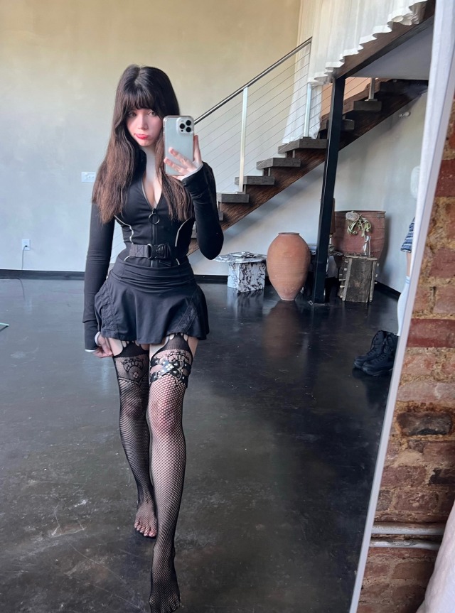 Great legs in black fashion thigh high fishnets