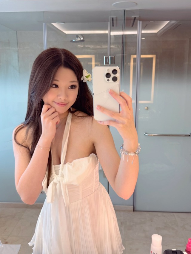 Pretty Asian girl taking a selfie in a cute dress
